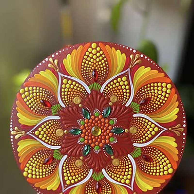 Mandala em pontilhismo em tons de laranja e vermelho